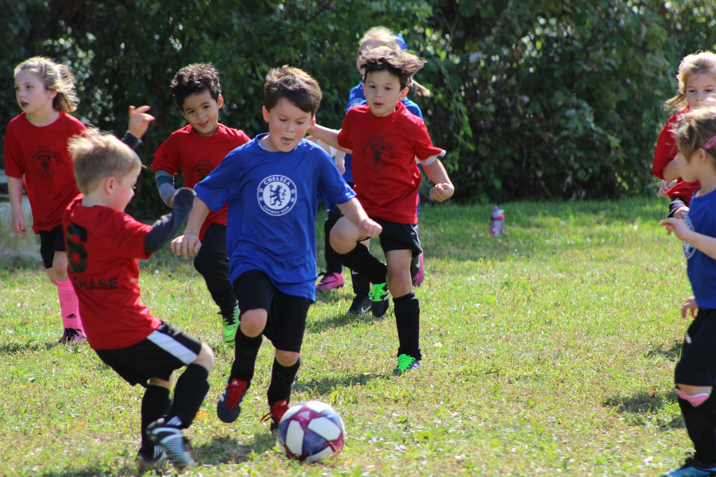 Soccer game in action, illustrating team and group assignment.